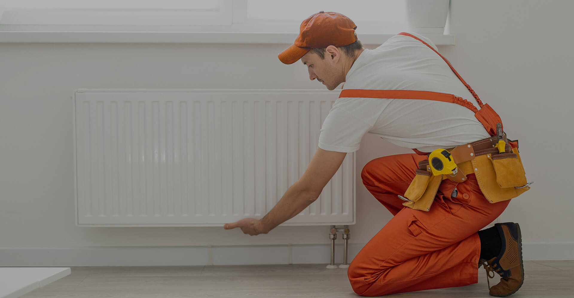 HVAC technician servicing a wall-mounted air conditioning unit